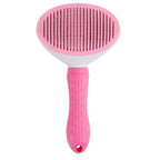 Uma escova oval de pelagem rosa e branca, com cabo rosa texturizado.