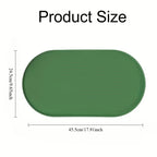 Tapete oval verde para alimentação com bordas elevadas; o diagrama do fornecedor indica aproximadamente 45,5 por 24,5 cm.